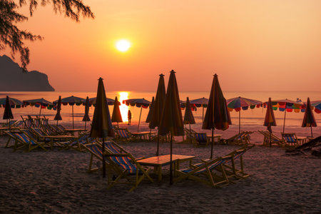 beach chairs with golden sunsetの写真素材