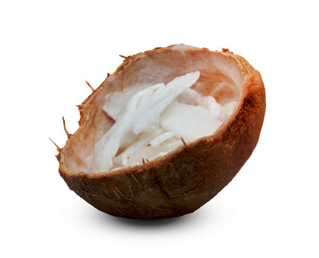 coconut flakes in shell isolated on white backgroundの写真素材