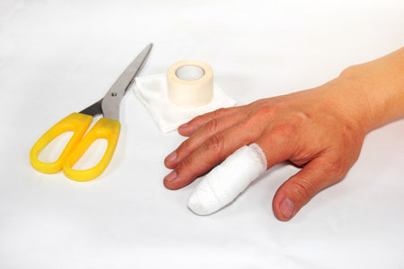 Forefinger with bandage  on backgroundの写真素材