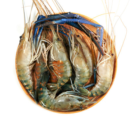 river shrimp common or Macrobrachium rosenbergii with wooden dish isolated on white backgroundの写真素材