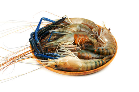 river shrimp common or Macrobrachium rosenbergii with wooden dish isolated on white backgroundの写真素材