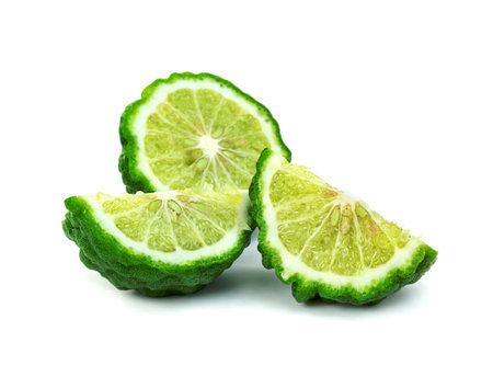 fresh bergamot fruit half isolated on white backgroundの写真素材