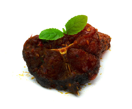 Stir Fried Crispy Catfish with Curry and leaf  fresh basil isolated on white backgroundの写真素材