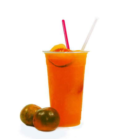 Slush ice with orange in Plastic Cup on white background.の写真素材