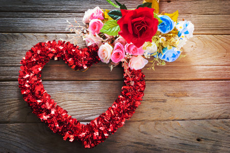 Tinsel heart  decoration on wood background,vintageの写真素材