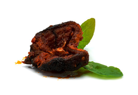 Stir Fried Crispy Catfish with Curry and leaf  fresh basil isolated on white backgroundの写真素材