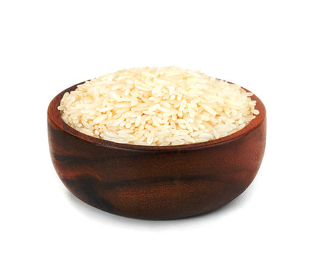 Thai jasmine rice in wooden bowl isolated on white backgroundの写真素材