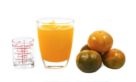 Slush ice with orange in Cup white background.の写真素材