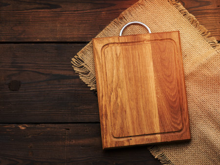 empty rectangular wooden cutting kitchen board on table, top viewの写真素材