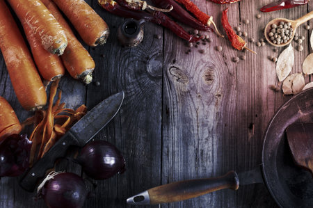 fresh vegetables and spices on gray wooden surface, pan frying, top viewの写真素材