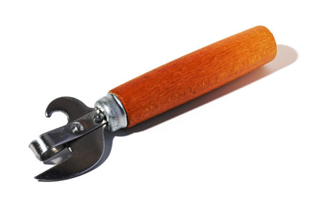 Hand opener for cans, bottles with a wooden handle on a white isolated backgroundの写真素材