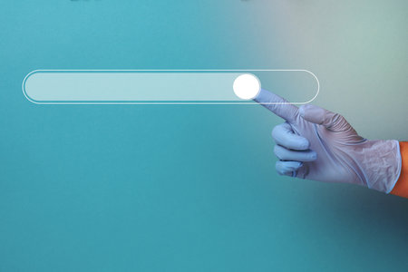 icon for searching and entering information and a hand in a blue medical glove. Virtual lane for loadingの写真素材