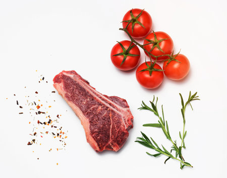 fresh raw piece of beef meat, striploin steakon white background, top view. Marbled piece of meat New Yorkの写真素材