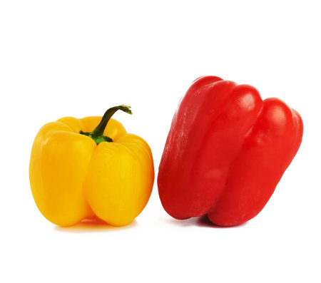 red and yellow sweet peppers isolated on white background, bunch of useful vegetables, close upの写真素材