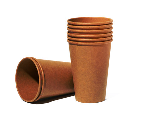 Empty brown paper disposable cups on a white background, concept eco-friendly, zero wasteの写真素材