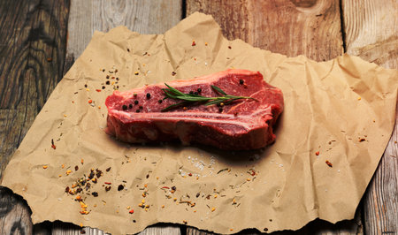 fresh raw piece of beef meat, striploin steak on a paper background, top view. Marbled piece of meat New Yorkの写真素材