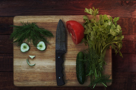 vegetables for healthy salad, sliced, funny face cucumber and dillの写真素材