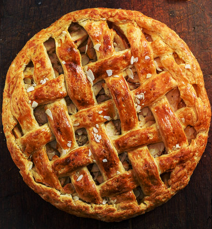 round baked fruit cake with a braided top, full frame, top viewの写真素材