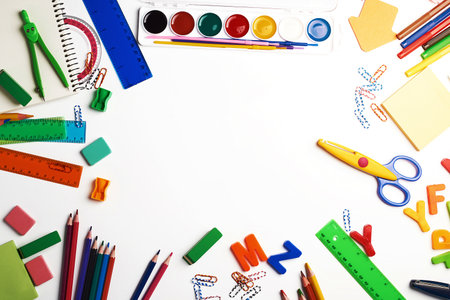 school supplies: multicolored wooden pencils, paper stickers, paper clips, pencil sharpener, copy spaceの写真素材
