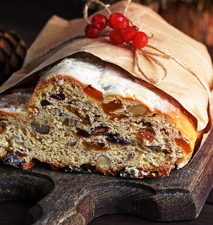 Traditional European Christmas pastry, fragrant home baked stollen, with spices and dried fruit, close upの写真素材