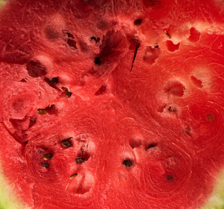 texture of ripe red watermelon with brown seeds, full frame, close upの写真素材