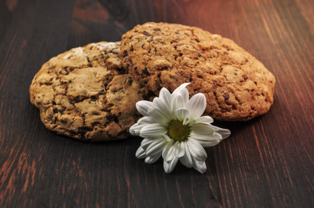 two cookies with cereals on a wooden backgroundの写真素材