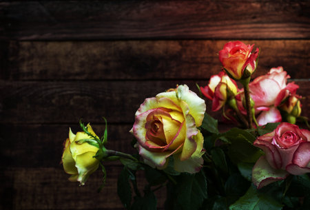 Vintage background with a bouquet of yellow rosesの写真素材