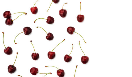 whole ripe red juicy sweet cherries isolated on a white background, top view, flat lay, copy spaceの写真素材