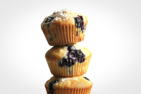 A photograph of a freshly baked blueberry muffins