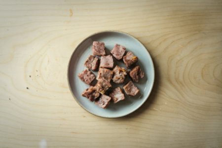 A photo of small chunks of meat on a plate.の写真素材