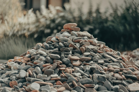 a meticulously stacked pile of weathered gray stonesの写真素材