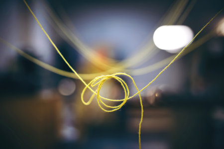 bokeh photo of a yellow thread.の写真素材
