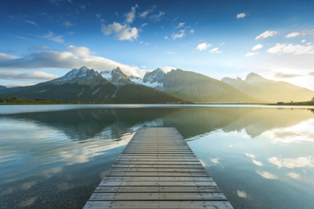 A photograph of a pristine alpine lake with crystal-clear turquoise watersの写真素材