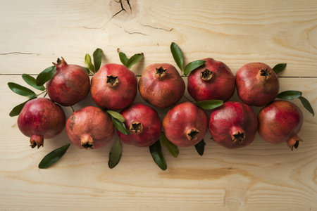 ripe pomegranates with leavesの写真素材