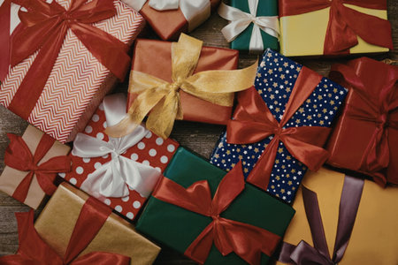 A collection of vibrantly wrapped gift boxes adorned with various colorful ribbons and patterns.
