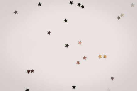 A collection of small, colorful stars scattered across a plain white background.