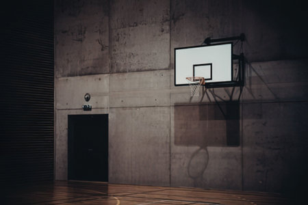 Abandoned basketball court in dark room