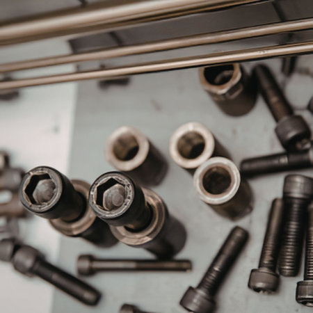 Collection of various bolts and tools