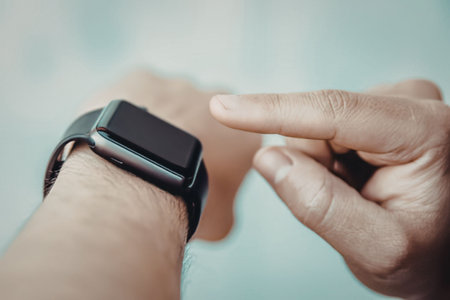 A person wearing a smartwatch on their wrist
