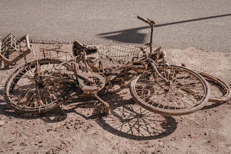 Abandoned bicycle lies on the ground