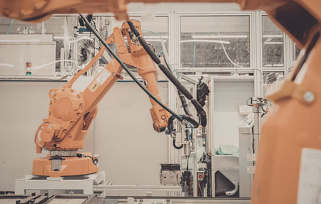 Industrial robot arm in manufacturing plant
