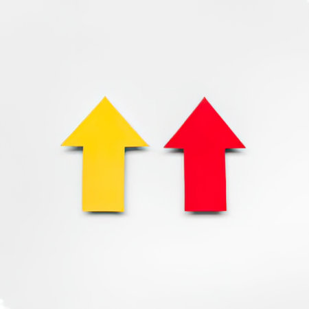 The image features two upward-pointing arrows, one yellow and one red, on a plain white background. The arrows are identical in shape and size, with the yellow arrow on the left and the red arrow on the right. They appear to be made of a flat material with a slight shadow underneath, giving a sense of depth. The simplicity of the image suggests it could be used for a variety of purposes, such as in a presentation, website, or infographic.