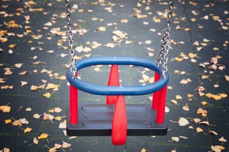 particularly of swing with fallen leaves from the backgroundの写真素材