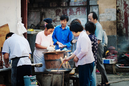 Shanghai, China - October 23 2006: Typical outdoor kitchen on a street in Shanghai, Chinaのeditorial素材