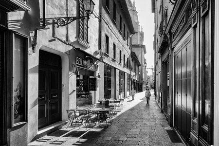 Bologna, Italy - September 04, 2016: People walk in a small street in the historic center of Bologna, in Italyのeditorial素材