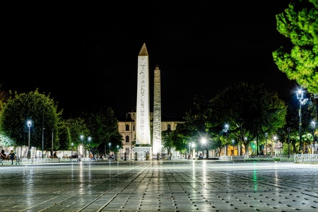 Istanbul, Turkey- September 20, 2017: Obelisk of Theodosius in the ancient Hippodrome Square in Istanbul, view at night with people sitting on benchesのeditorial素材