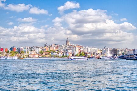 Istanbul, Turkey- September 21, 2017: Galata Tower in Istanbul with tourist ships in the foregroundのeditorial素材