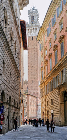 Siena, Italy - 03 March, 2019: Torre del Mangia, located in the famous Piazza del Campo
