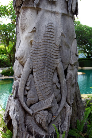 Wood carving of the elephants on the trunk の写真素材