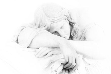 Black and white carved statue of a grieving woman with eyes closed laying over a tomb her face resting on her crossed arms and holding a cloth from Florence, Italyのeditorial素材
